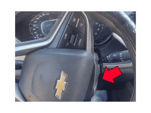 Gros plan sur le volant d'une Chevrolet Groove indiquant la zone de démarrage